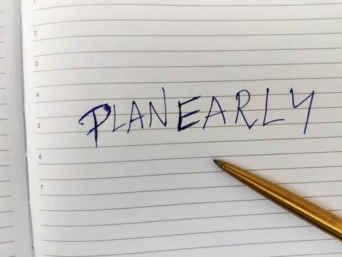 A Daily diary with text PLAN EARLY and pen. Stock Photos