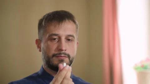 Daily medication use. Life-saving drugs. Man in front of a mirror Vídeo Stock 168897607