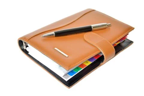 Daily planner with pen 스톡 사진