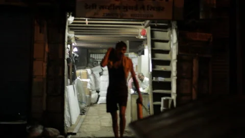 Daily wage workers carrying heavy load cargo, Mumbai, IndiaStock Footage