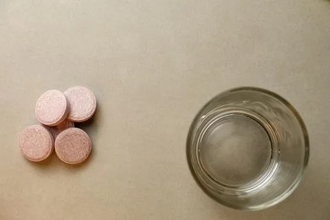 Daily wellness routine with effervescent tablets and glass of water at home Stock Photos