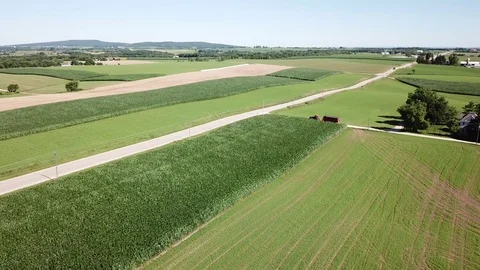 Dairy farm pan over fields, farmhouse, and barn. Stock-Footage 92054646