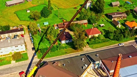 Dairy processing plant site with large crane operating for modernization and Stock Footage 334744228