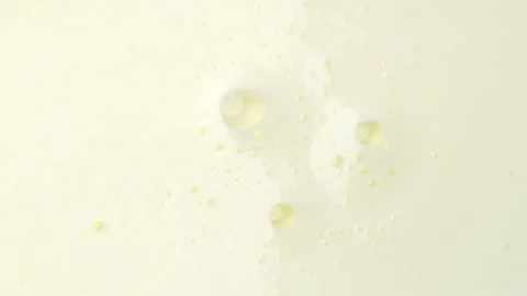 Dairy product with bubbles background, top view, flat lay backdrop Vidéo 334228813