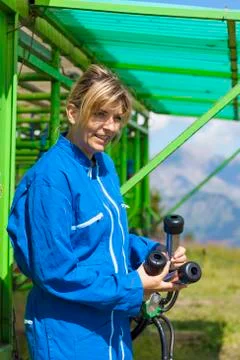 Dairymaid at automatic milking system Stock Photos