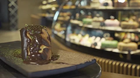 Daisy on a slice of chocolate cake Stock Footage 167589101