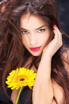 Daisy on woman's chest Stock Photos