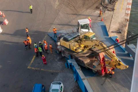 Dakar, Senegal - 07/12/2019: An incident of unloading an excavator at the port Stock Photos