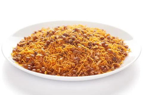 Dal Bijli or Dal moth in white ceramic plate, roasted Masoor Dal (black lentils) Stock Photos