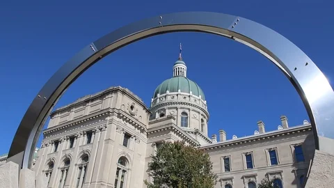Dale Enochs' "Time Flow" framing the Indiana State House - 30 seconds Stock Footage 117734376