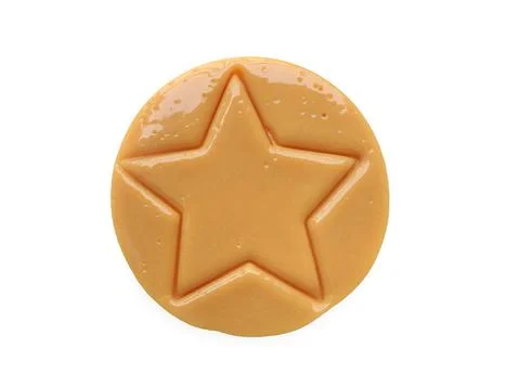 Dalgona candy or Ppopgi. Sugar Honeycomb cookie with star shape  Stock Photos