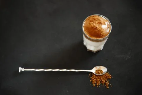 Dalgona coffee on the dark background with copy space 库存照片