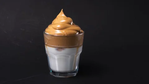 Dalgona coffee making, whipped iced cold coffee with milk. Stop motion animation Stock Footage 129805589