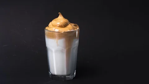 Dalgona coffee making, whipped iced cold coffee with milk. Stock Footage 129807946