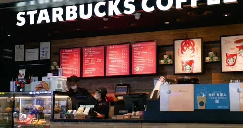 Dalian China 9.2.24 view of workers in China's airport Starbucks: dynamic, Stock Footage 264559051