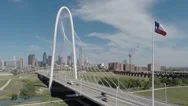 Dallas Skyline Aerial With Landmark Bridge And Texas Flag Stock Footage