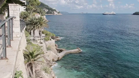 Dalmatian coast with steps leading to sunbathing pier, Dubrovnik, Croatia, 4K Video stock 274454554