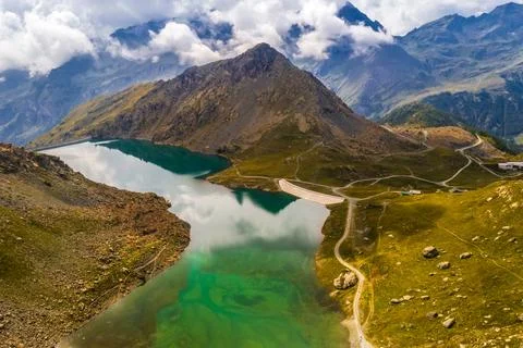 Dam in alpine mountains Stock Photos