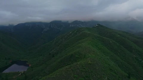 Dam below a misty mountain ridge, cinematic aerial, South Africa Stock Footage 342335866