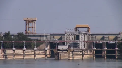 Dam blocks Kuban River. Car traffic across river on bridge built on dam. Stock Footage 155727852