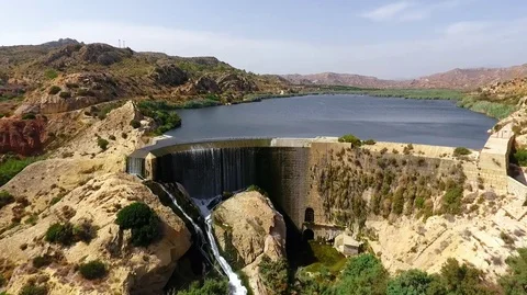 Dam in the city of Elche. First arched dam aerial view. Pantano de Elche Stock Footage 128603950