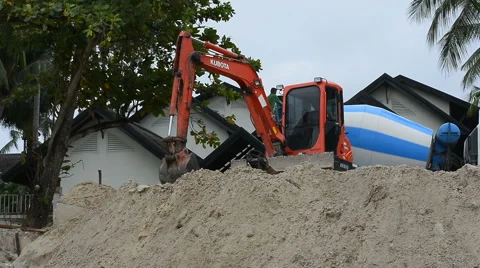 Dam construction with Backhoe along the beach to reduce the waves Video stock 64617939