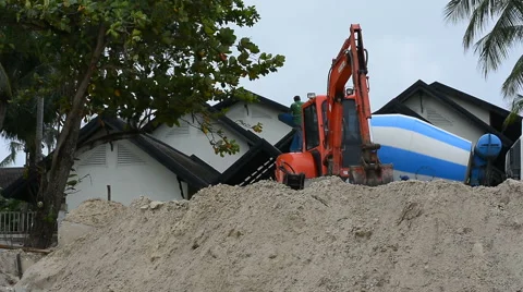 Dam construction with Backhoe along the beach to reduce the waves 스톡 동영상 64617979