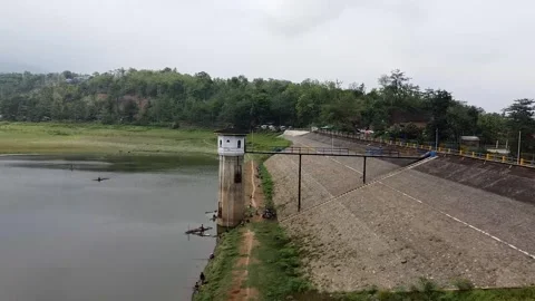 Dam with control tower and bridge on an overcast day Video stock 279259761