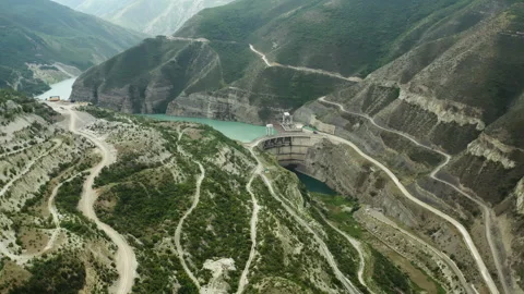 Dam to control the water level. The industrial building stands in the middle of Stock Footage 260819084
