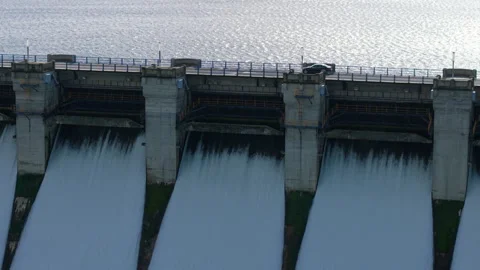 Dam discharging a massive volume of water for hydroelectric power generation Stock Footage 328354540
