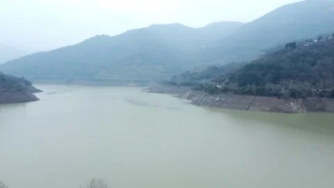 Dam drone view. Low water level in dam. Drought in reservoir. Aerial view of dam Stock Footage 234841109