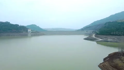 Dam drone view. Low water level in dam. Drought in reservoir. Aerial view of dam Stock Footage 234841137
