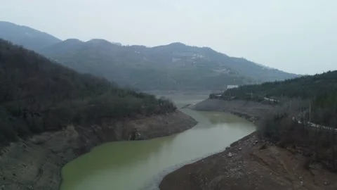 Dam drone view. Low water level in dam. Drought in reservoir. Aerial view of dam Stock Footage 234841158