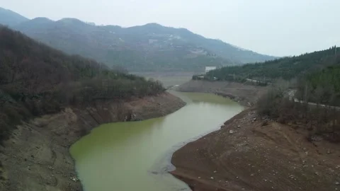 Dam drone view. Low water level in dam. Drought in reservoir. Aerial view of dam Stock Footage 234841175