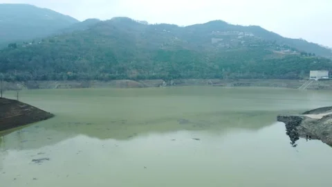 Dam drone view. Low water level in dam. Drought in reservoir. Aerial view of dam Stock Footage 234841225