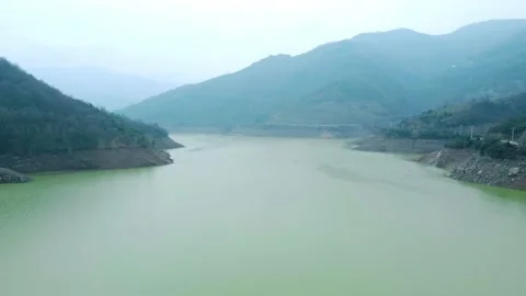 Dam drone view. Low water level in dam. Drought in reservoir. Aerial view of dam Stock Footage 234841256