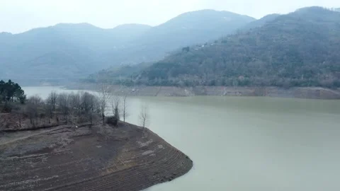 Dam drone view. Low water level in dam. Drought in reservoir. Aerial view of dam Stock Footage 234841272