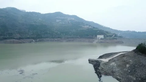 Dam drone view. Low water level in dam. Drought in reservoir. Aerial view of dam Stock Footage 234841307