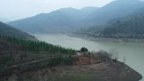 Dam drone view. Low water level in dam. Drought in reservoir. Aerial view of dam Stock Footage 234841323
