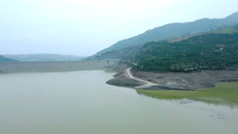 Dam drone view. Low water level in dam. Drought in reservoir. Aerial view of dam Stock Footage 234841347