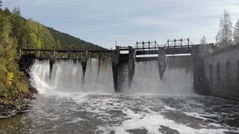 Dam with flowing water through gates. Hydroelectric power station, aerial top Stock Footage 150297799