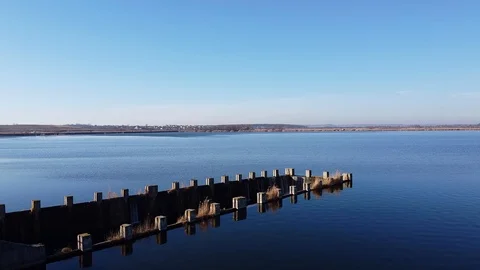 Dam Lake under blue cloudy sky aero Stock Footage 122949888