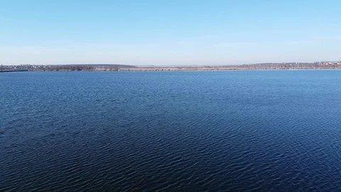Dam Lake under blue cloudy sky aero Stock Footage 122951755