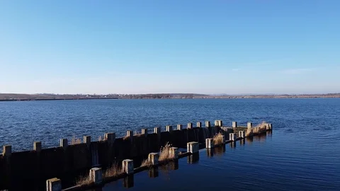 Dam Lake under blue cloudy sky aero Stock Footage 122952257