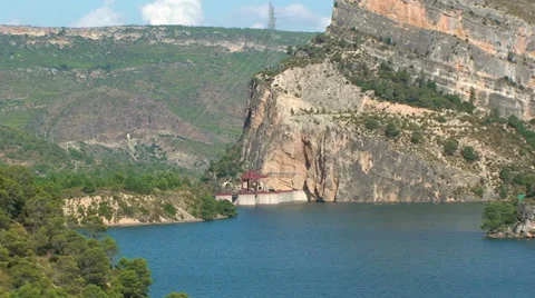 Dam lake in a valley covered by pine forests Stock Footage 50081664