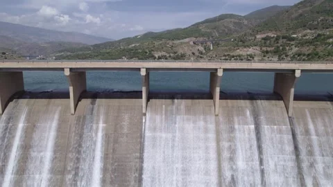 Dam operational maneuvers. Dam spillway releasing water. Travel aerial view 库存影片 340918546