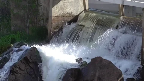 Dam Runoff on the Rocks Stock Footage 77486524