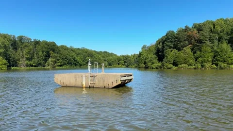 Dam Spillway Riser Tower on a Neighborhood Lake Stock Footage 345457682