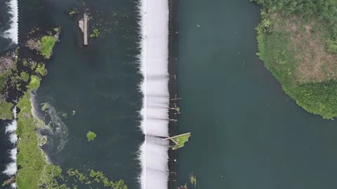 Dam Splitting River Aerial View with Smoke and Debris. Stock Footage 338402438