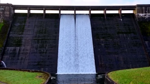 Dam wall sunset from base of the wall to overlooking the dam  Video stock 264502972